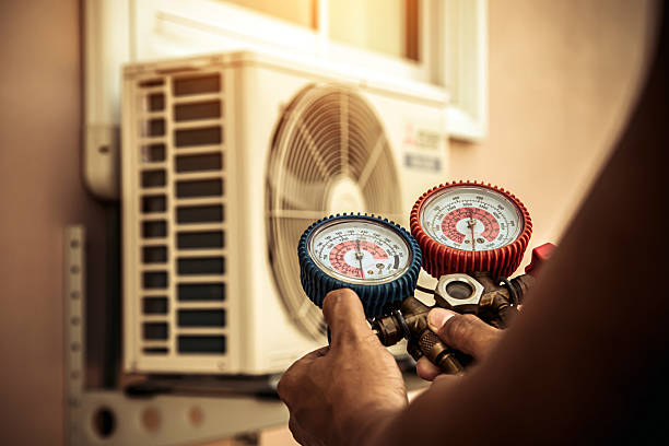 Professional Air Conditioning Service technician working in Pylesville, MD